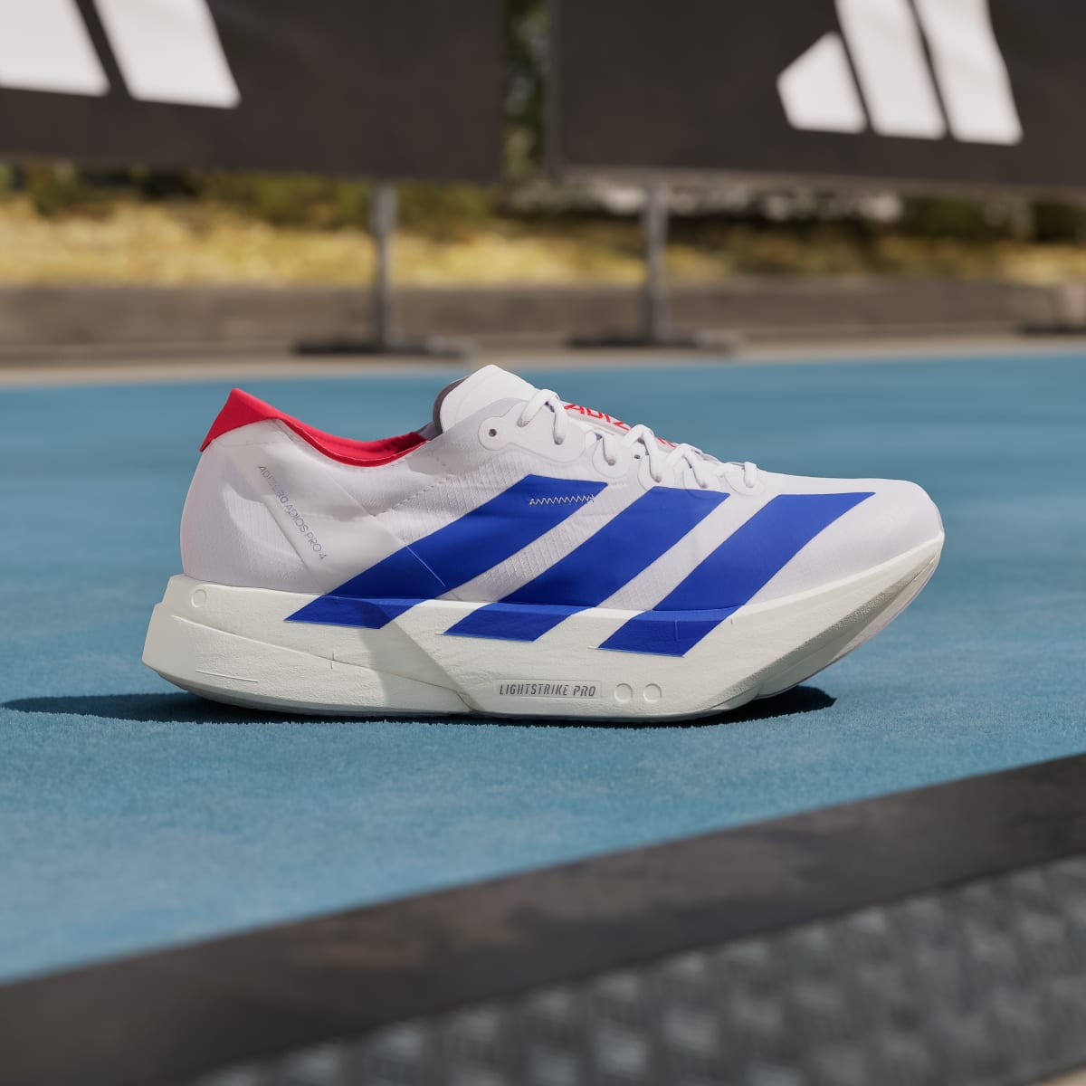 Adidas Adizero Adios Pro 4 Sneakers - Cloud White / Royal Blue / Pure Ruby - view 3