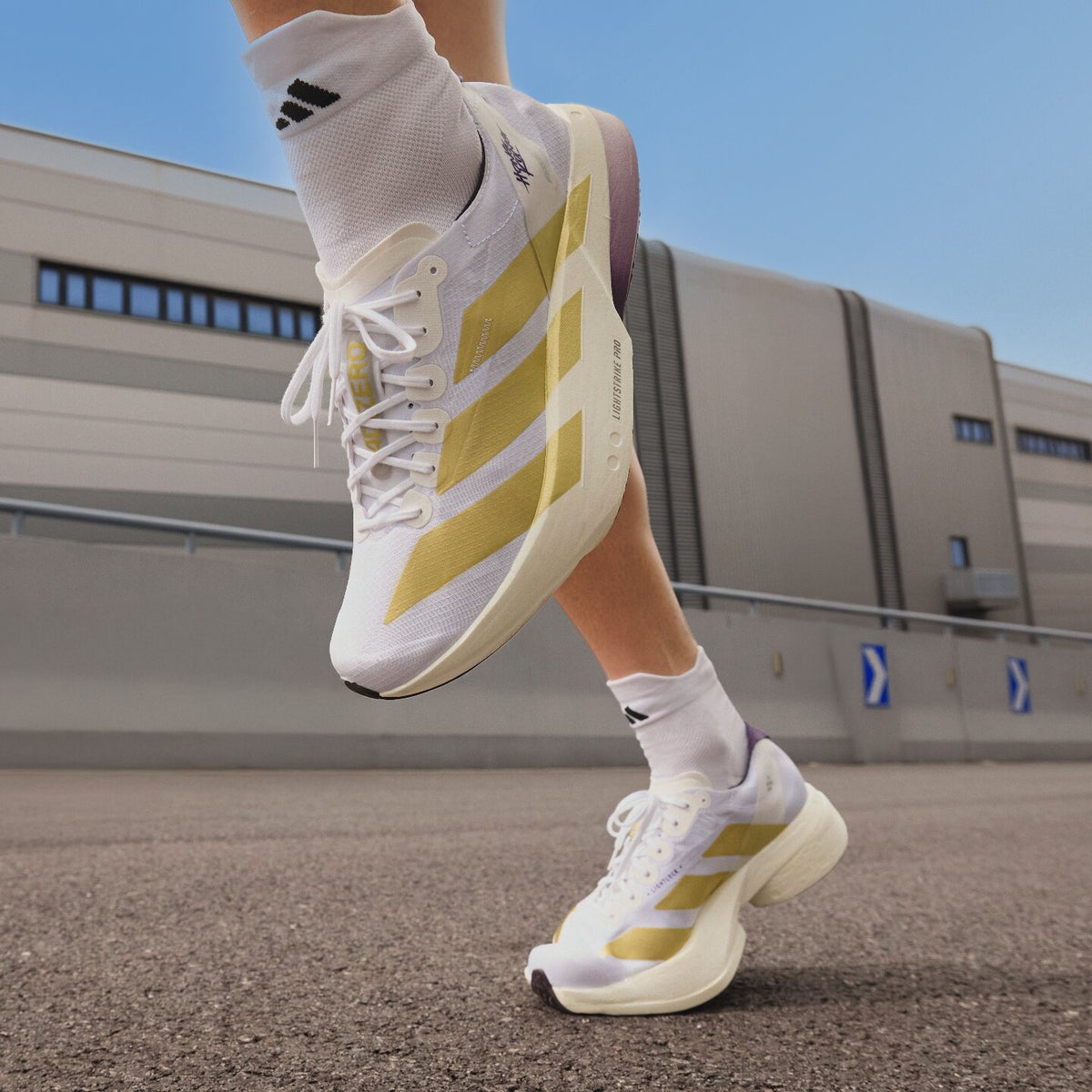 Adidas Adizero Adios PRO 4 Sneakers - White / Gold / Aurora Plum - view 1
